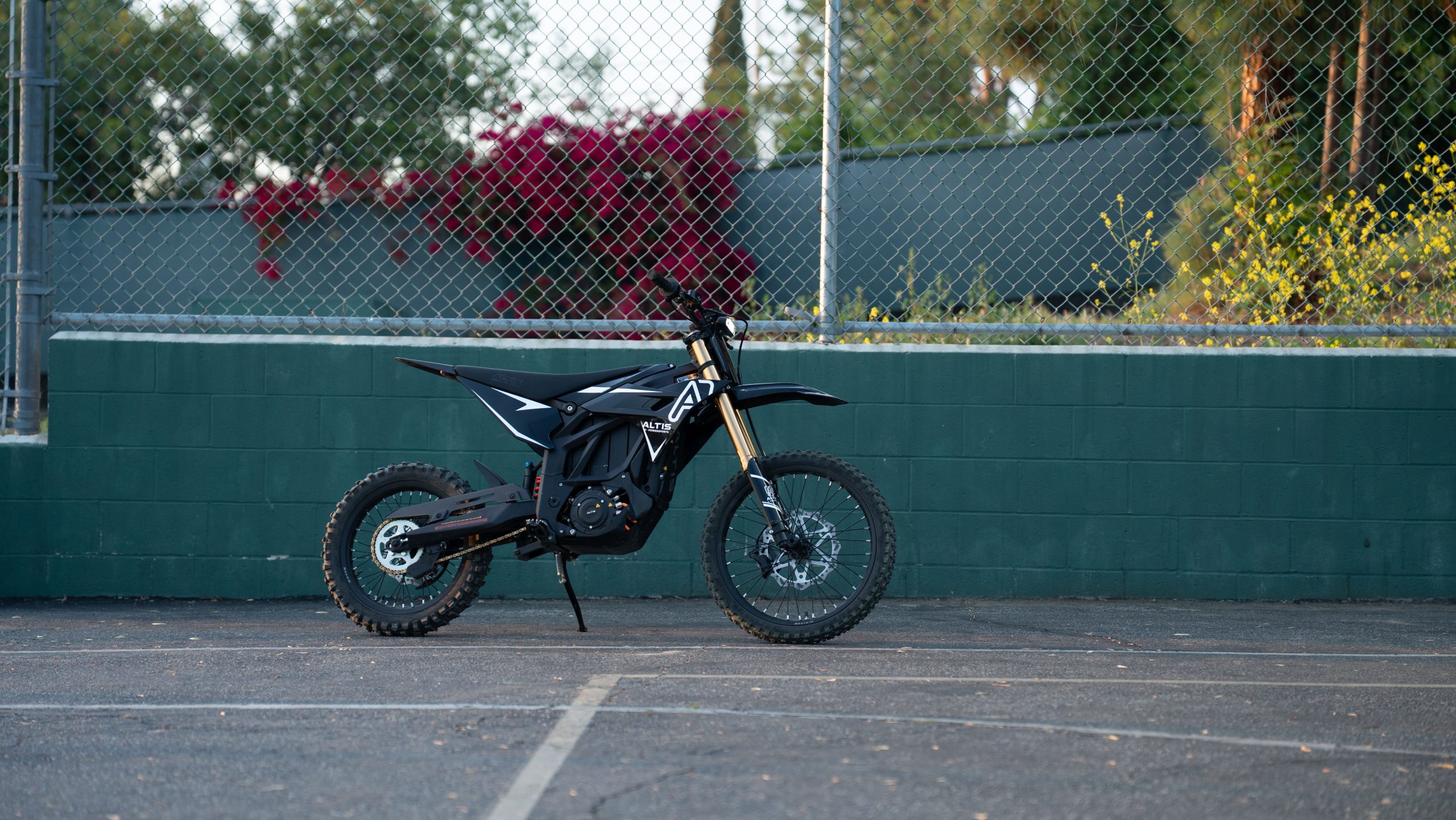 Altis Sigma high performance electric motocross bike side view parked outdoors