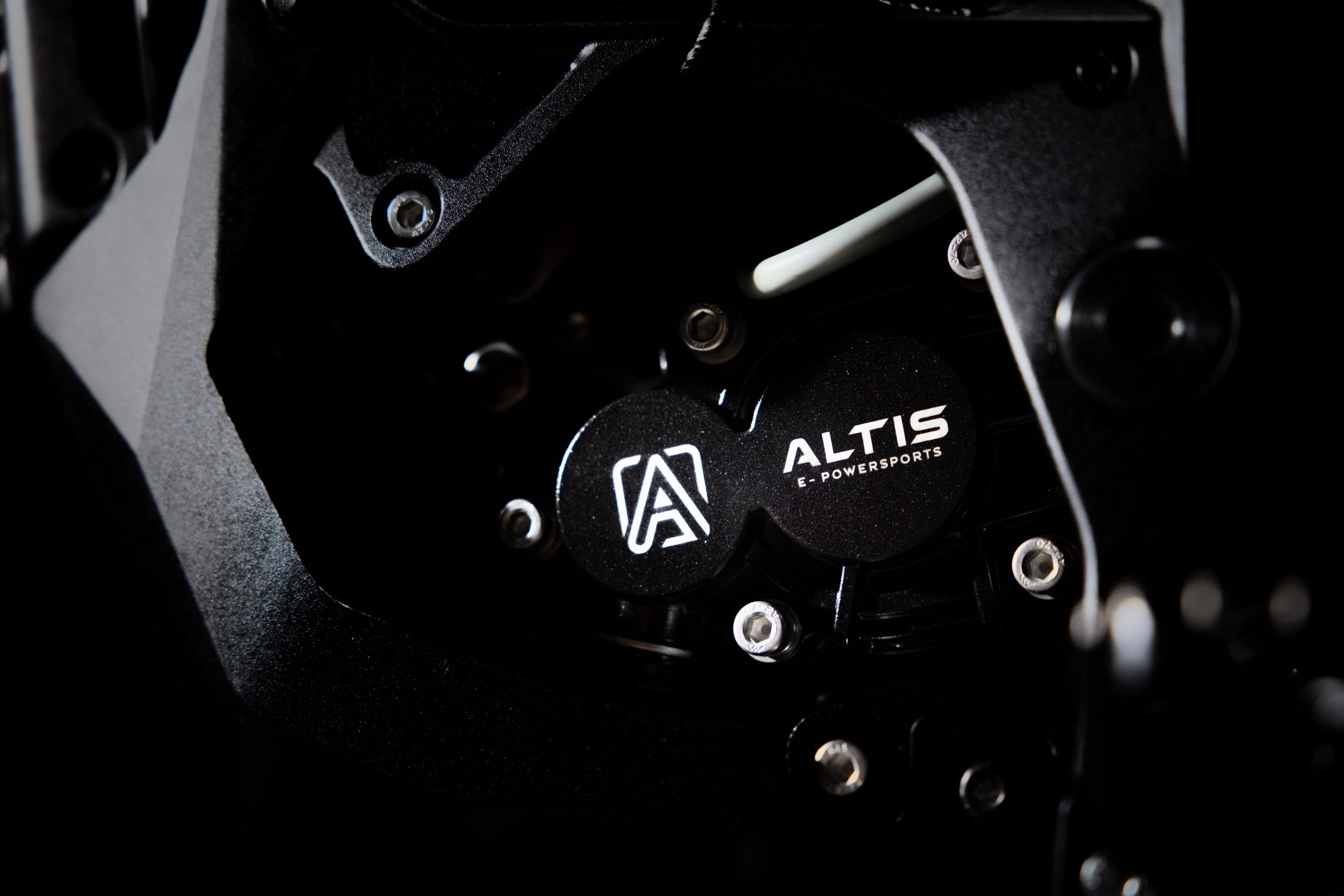 Altis E-Powersports logo badge on the Altis Sigma high performance electric motorcycle motor casing