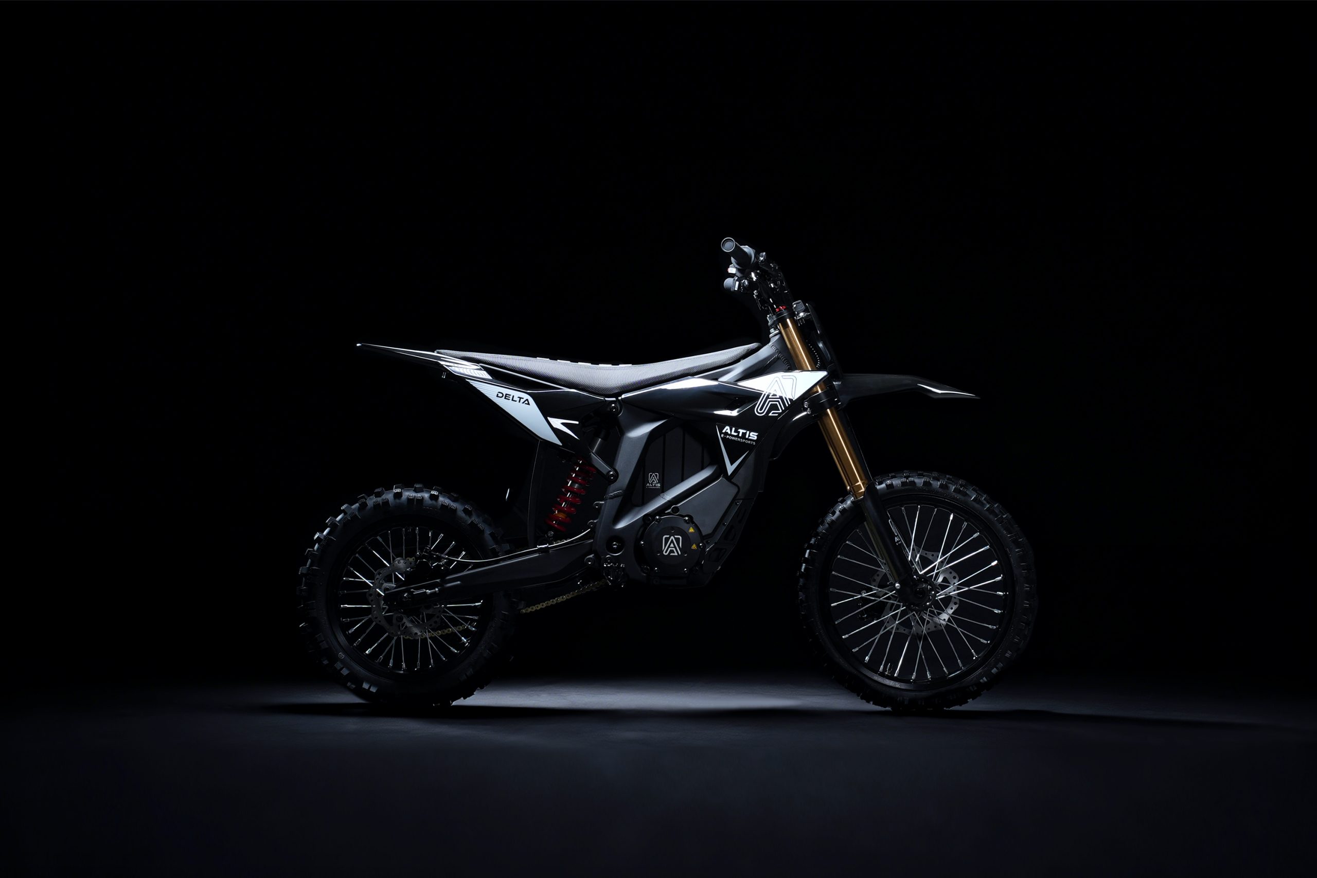 Altis Delta electric motocross motorcycle studio profile shot on dark background with Delta and Altis branding