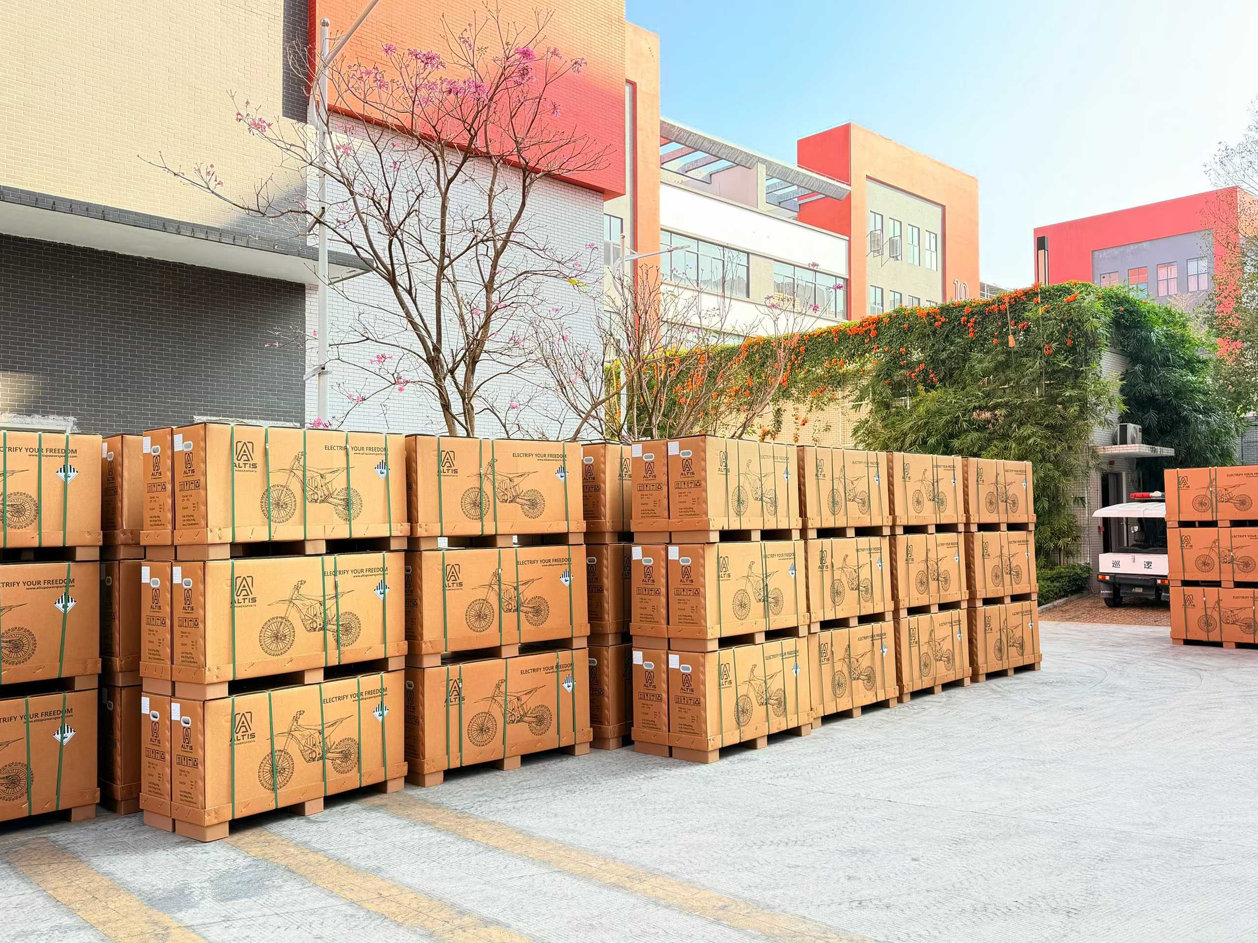 Altis Delta electric motorcycle shipping boxes stacked at warehouse ready for delivery